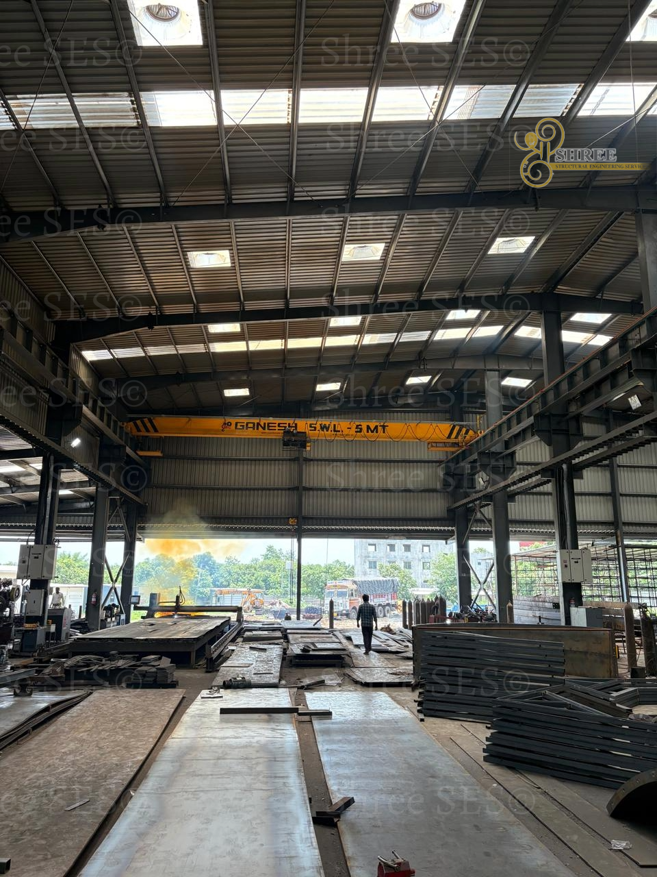 Precision Structural Drawings: Ensuring Flawless Crane Alignment Operational high-tonnage EOT crane supported by a precision PEB steel structure, demonstrating the dependability of our detailed structural drawings.