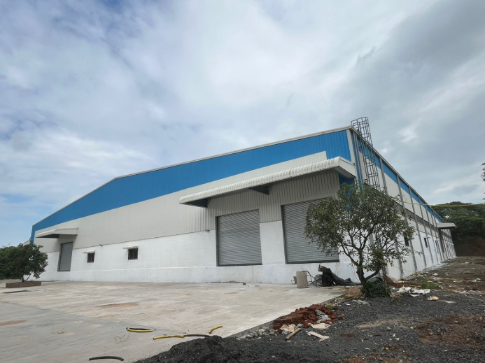 Completed 100,000 sq ft PEB warehouse shed near Surat, showcasing zero-error steel erection and 100% structural integrity - detailed PEB design - ShreeSES
