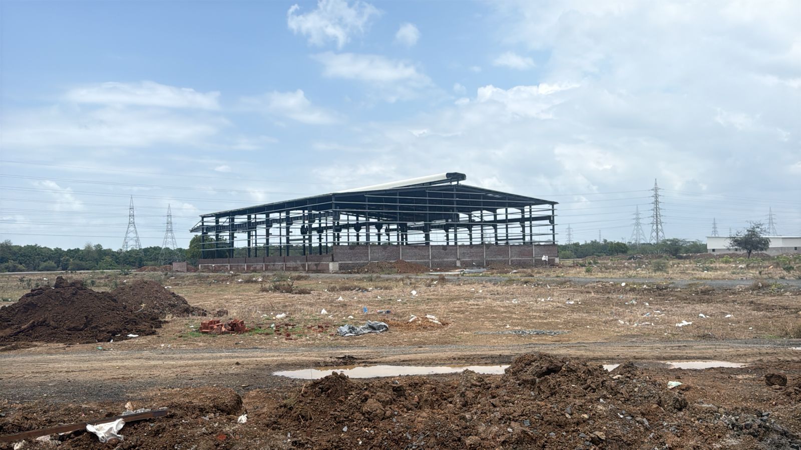 Precision-engineered PEB structural steel framing by SHREESES - partner with us for your next project. Erection of Structural steel framework for a pre-engineered industrial building designed by PEB structural engineering consultants.